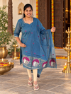 Blue festive salwar suit with printed cow motif border and matching dupatta, front view
